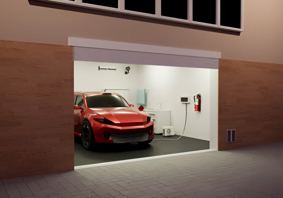 A car parked in a tight garage with foam padding on the walls to prevent door dings."