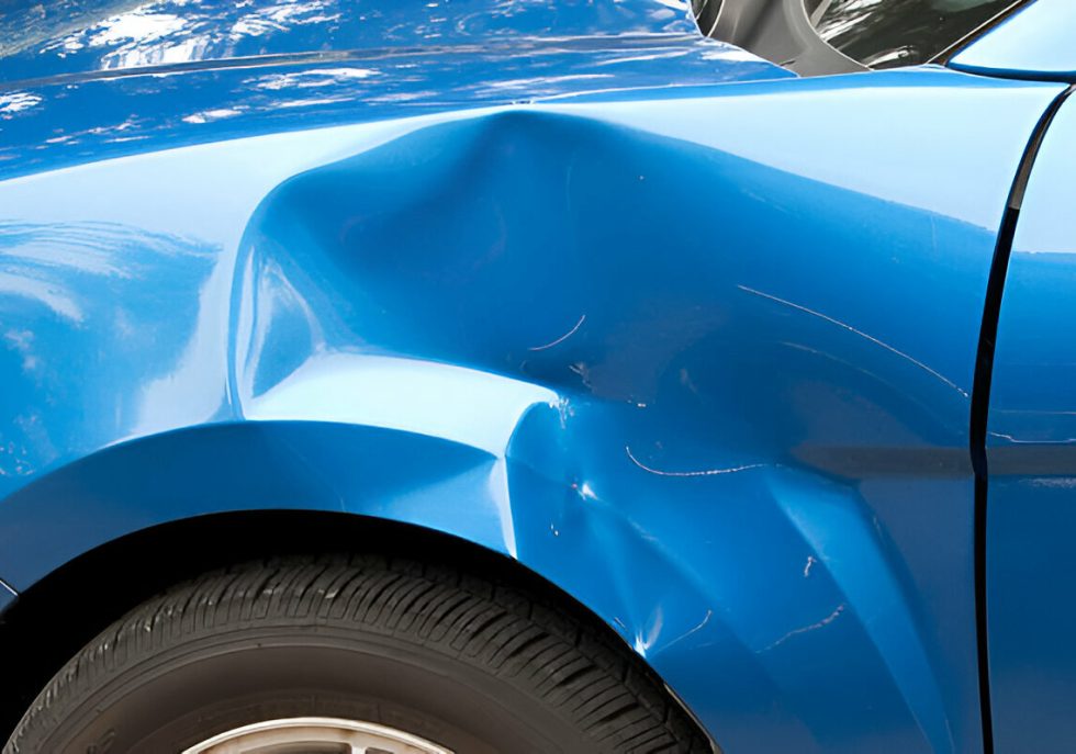 Technician performing mobile Paintless Dent Repair (PDR) at a customer's location."