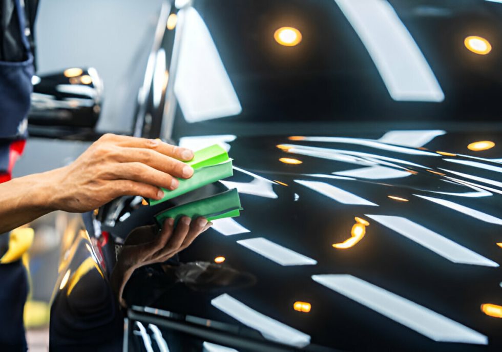 A technician performing PDR on a Tesla Model 3."