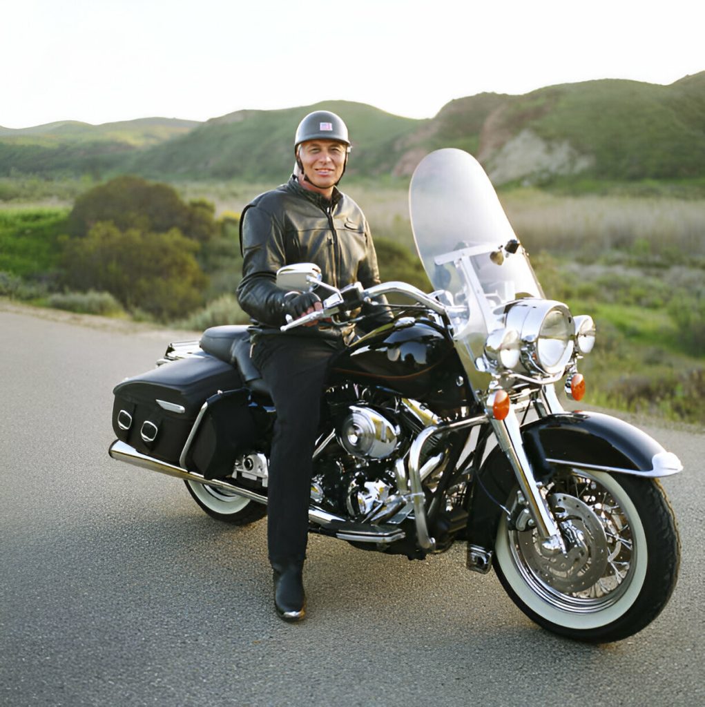 "Motorcycle fuel tank being repaired using Paintless Dent Repair (PDR) techniques."
