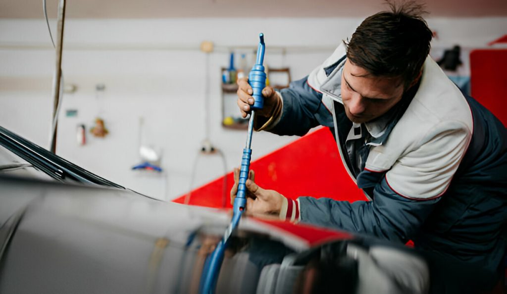 "A driver carefully parking their car to avoid door dings."